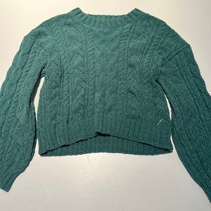Green long-sleeved sweater